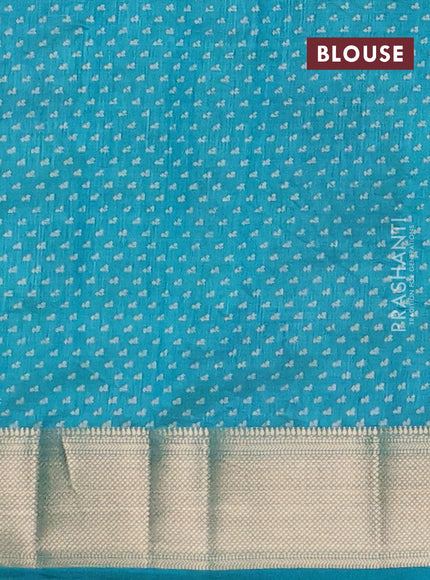 Semi raw silk saree teal green with allover floral prints and zari woven border
