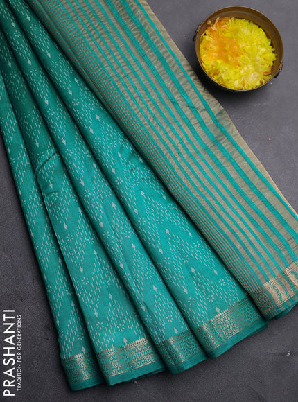 Semi raw silk saree teal blue with allover zigzag prints and zari woven border