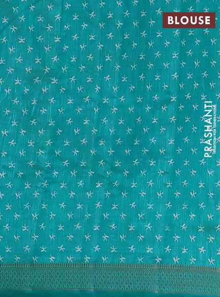 Semi raw silk saree teal blue with allover zigzag prints and zari woven border
