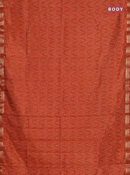 Semi raw silk saree rust shade with allover zigzag prints and zari woven border