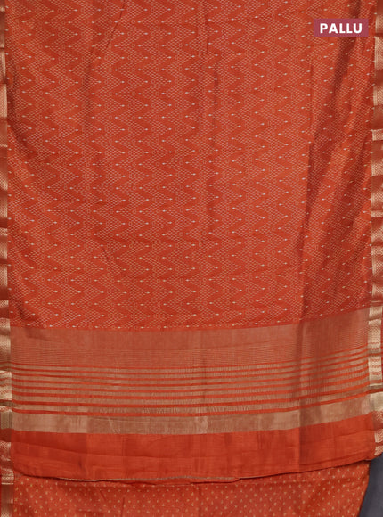 Semi raw silk saree rust shade with allover zigzag prints and zari woven border