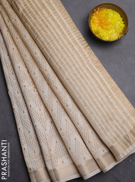 Semi raw silk saree cream with allover zigzag prints and zari woven border