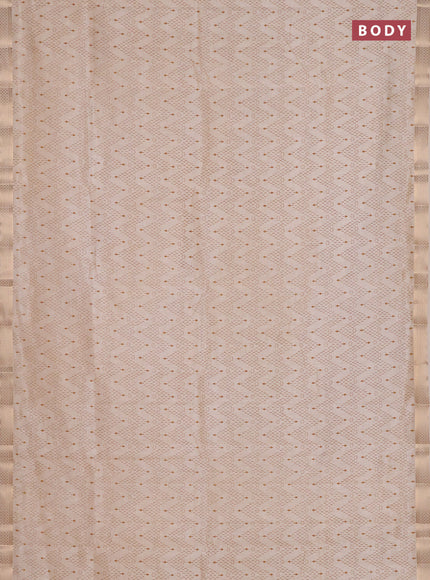 Semi raw silk saree cream with allover zigzag prints and zari woven border