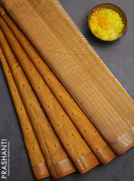 Semi raw silk saree mustard yellow with allover zigzag prints and zari woven border