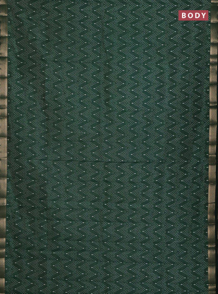 Semi raw silk saree bottle green with allover zigzag prints and zari woven border