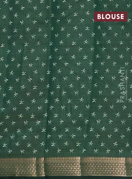 Semi raw silk saree bottle green with allover zigzag prints and zari woven border