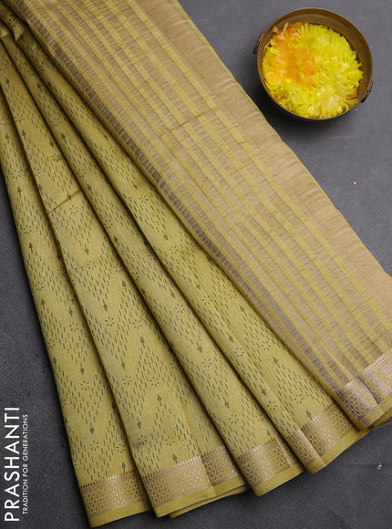 Semi raw silk saree lime green with allover zigzag prints and zari woven border