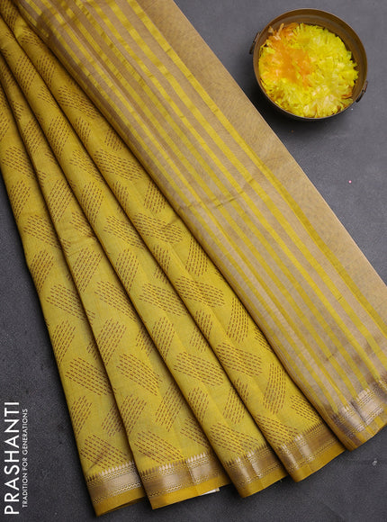 Semi raw silk saree lime green with allover butta prints and zari woven border
