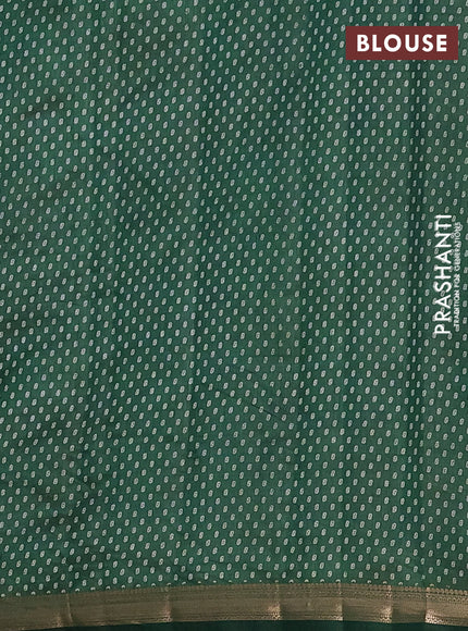 Semi raw silk saree bottle green with allover butta prints and zari woven border