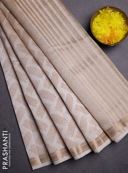Semi raw silk saree cream with allover butta prints and zari woven border