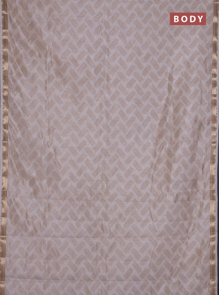 Semi raw silk saree cream with allover butta prints and zari woven border