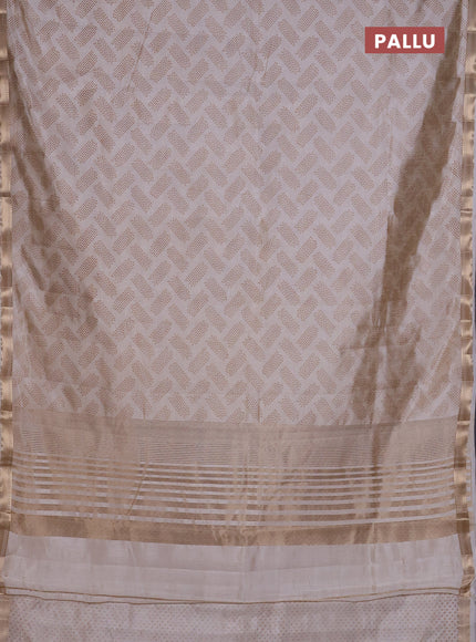 Semi raw silk saree cream with allover butta prints and zari woven border