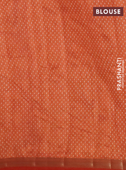 Semi raw silk saree rust shade with allover butta prints and zari woven border