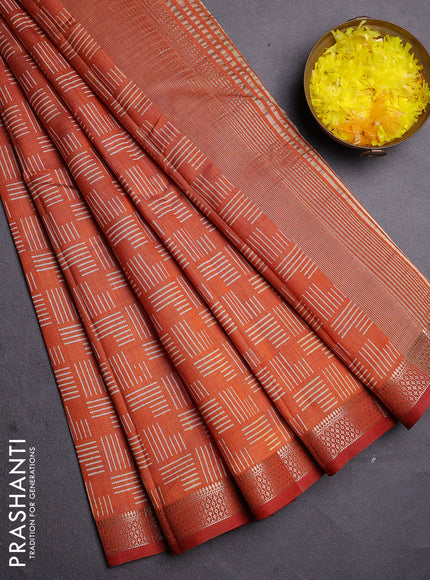 Semi raw silk saree rust shade with allover geometric prints and zari woven border
