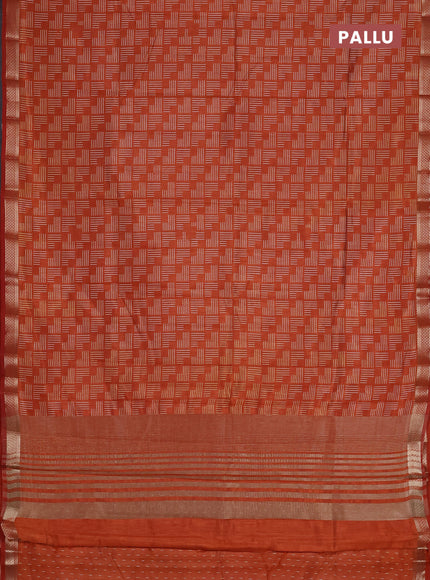 Semi raw silk saree rust shade with allover geometric prints and zari woven border