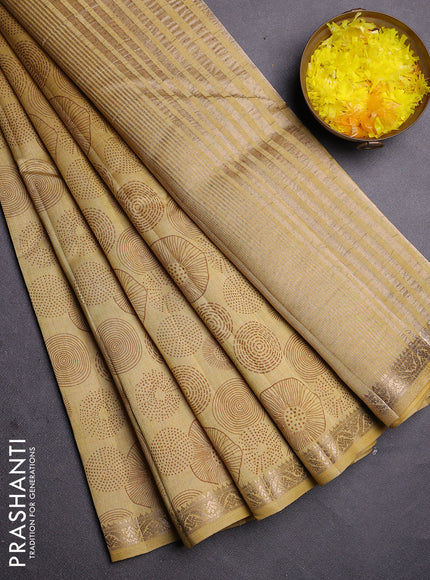Semi raw silk saree mustard shade with allover geometric prints and zari woven border