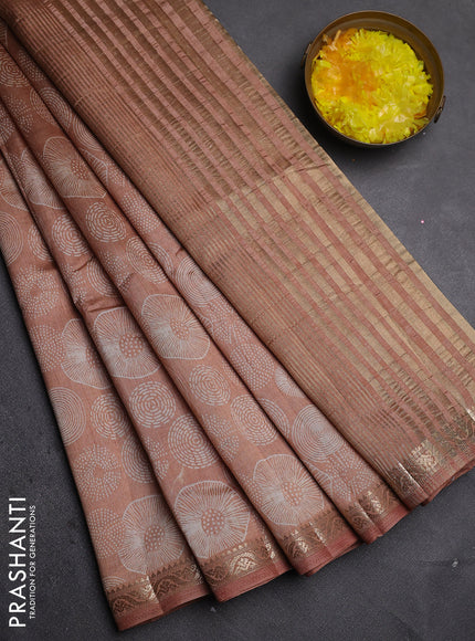 Semi raw silk saree pastel peach with allover geometric prints and zari woven border