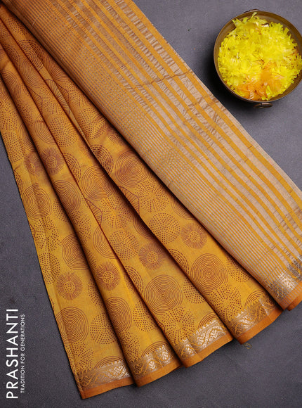 Semi raw silk saree mustard yellow with allover geometric prints and zari woven border