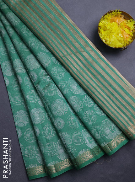 Semi raw silk saree green shade with allover geometric prints and zari woven border