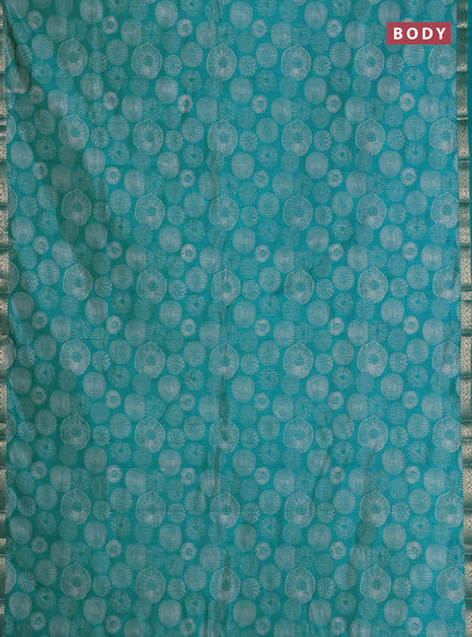Semi raw silk saree teal blue with allover geometric prints and zari woven border
