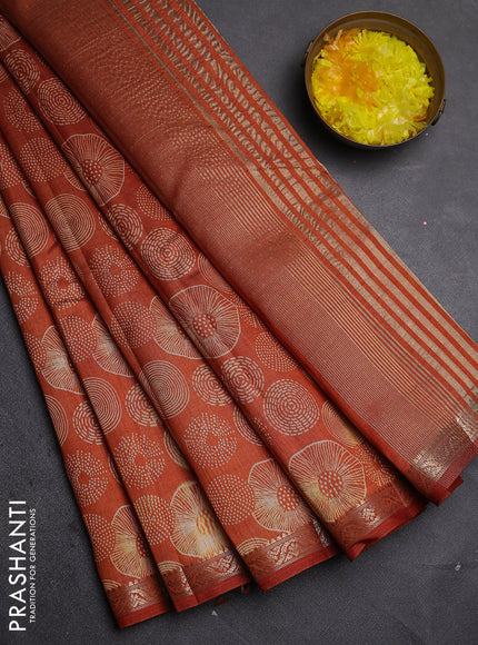 Semi raw silk saree rust shade with allover geometric prints and zari woven border