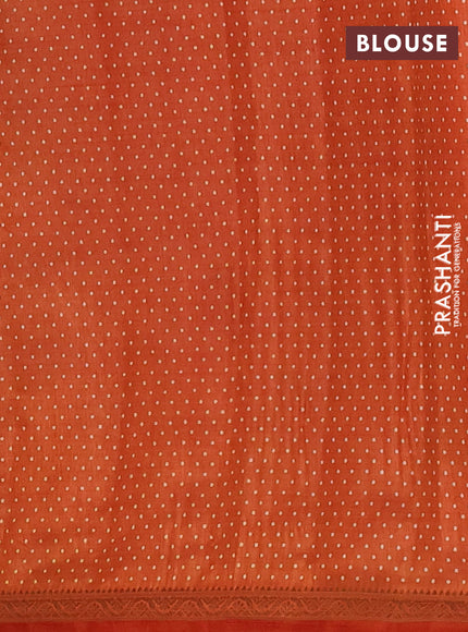 Semi raw silk saree rust shade with allover geometric prints and zari woven border