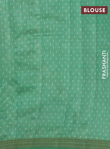 Semi raw silk saree green with allover paisley prints and zari woven border