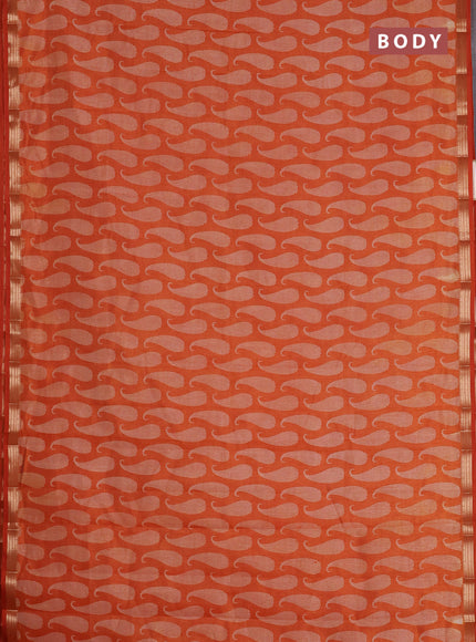 Semi raw silk saree rust shade with allover paisley prints and zari woven border