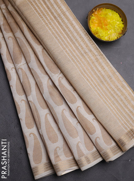 Semi raw silk saree cream with allover paisley prints and zari woven border
