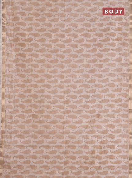 Semi raw silk saree cream with allover paisley prints and zari woven border