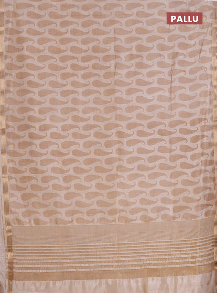 Semi raw silk saree cream with allover paisley prints and zari woven border