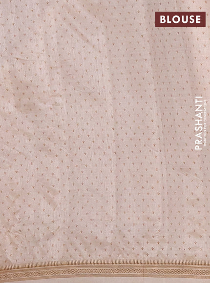 Semi raw silk saree cream with allover paisley prints and zari woven border