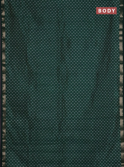 Semi raw silk saree bottle green with allover butta prints and zari woven border