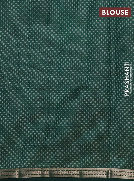 Semi raw silk saree bottle green with allover butta prints and zari woven border