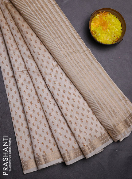 Semi raw silk saree cream with allover butta prints and zari woven border