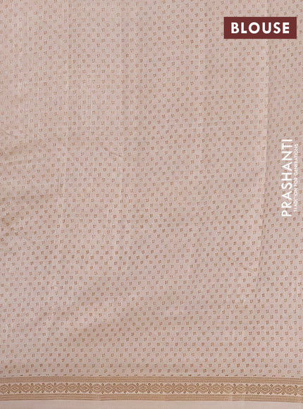 Semi raw silk saree cream with allover butta prints and zari woven border
