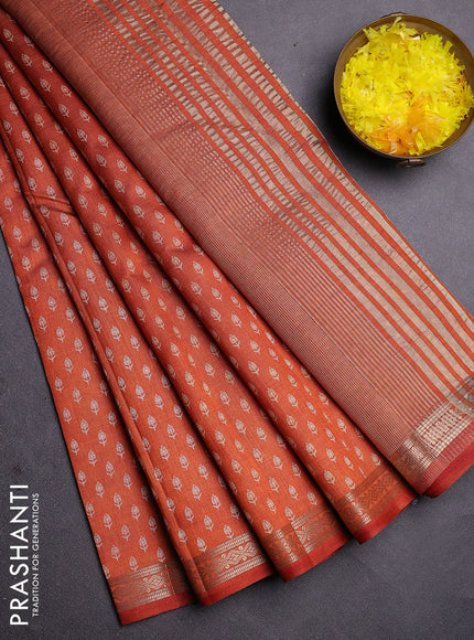 Semi raw silk saree rust shade with allover butta prints and zari woven border