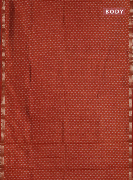Semi raw silk saree rust shade with allover butta prints and zari woven border
