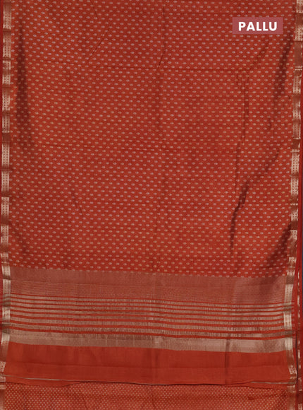 Semi raw silk saree rust shade with allover butta prints and zari woven border