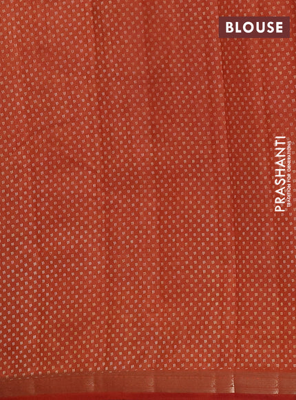 Semi raw silk saree rust shade with allover butta prints and zari woven border