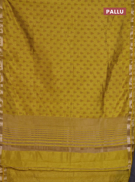 Semi raw silk saree lime yellow with allover butta prints and zari woven border