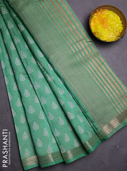 Semi raw silk saree green with allover butta prints and zari woven border