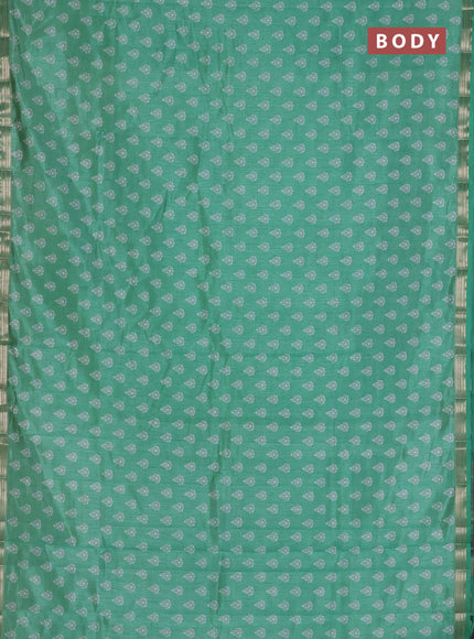 Semi raw silk saree green with allover butta prints and zari woven border
