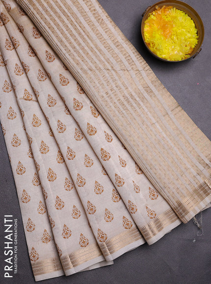 Semi raw silk saree off white with allover butta prints and zari woven border