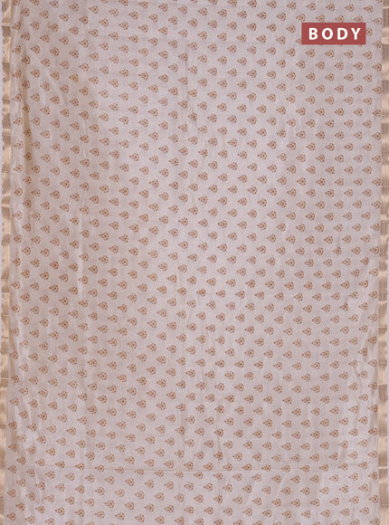 Semi raw silk saree off white with allover butta prints and zari woven border