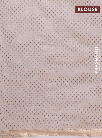 Semi raw silk saree off white with allover butta prints and zari woven border