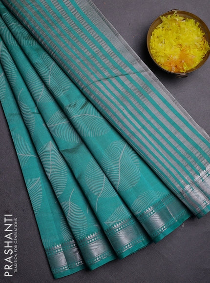 Semi raw silk saree teal blue with allover leaf butta prints and zari woven border