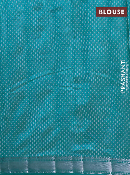 Semi raw silk saree teal blue with allover leaf butta prints and zari woven border