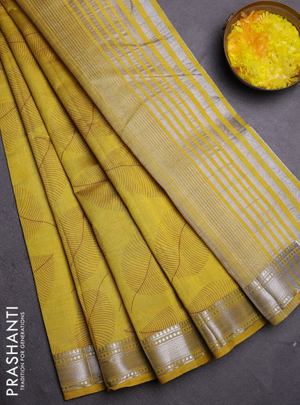Semi raw silk saree mustard yellow with allover leaf butta prints and zari woven border