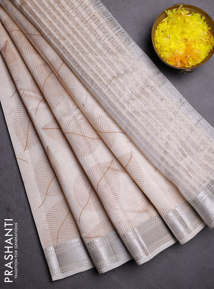 Semi raw silk saree cream with allover leaf butta prints and zari woven border